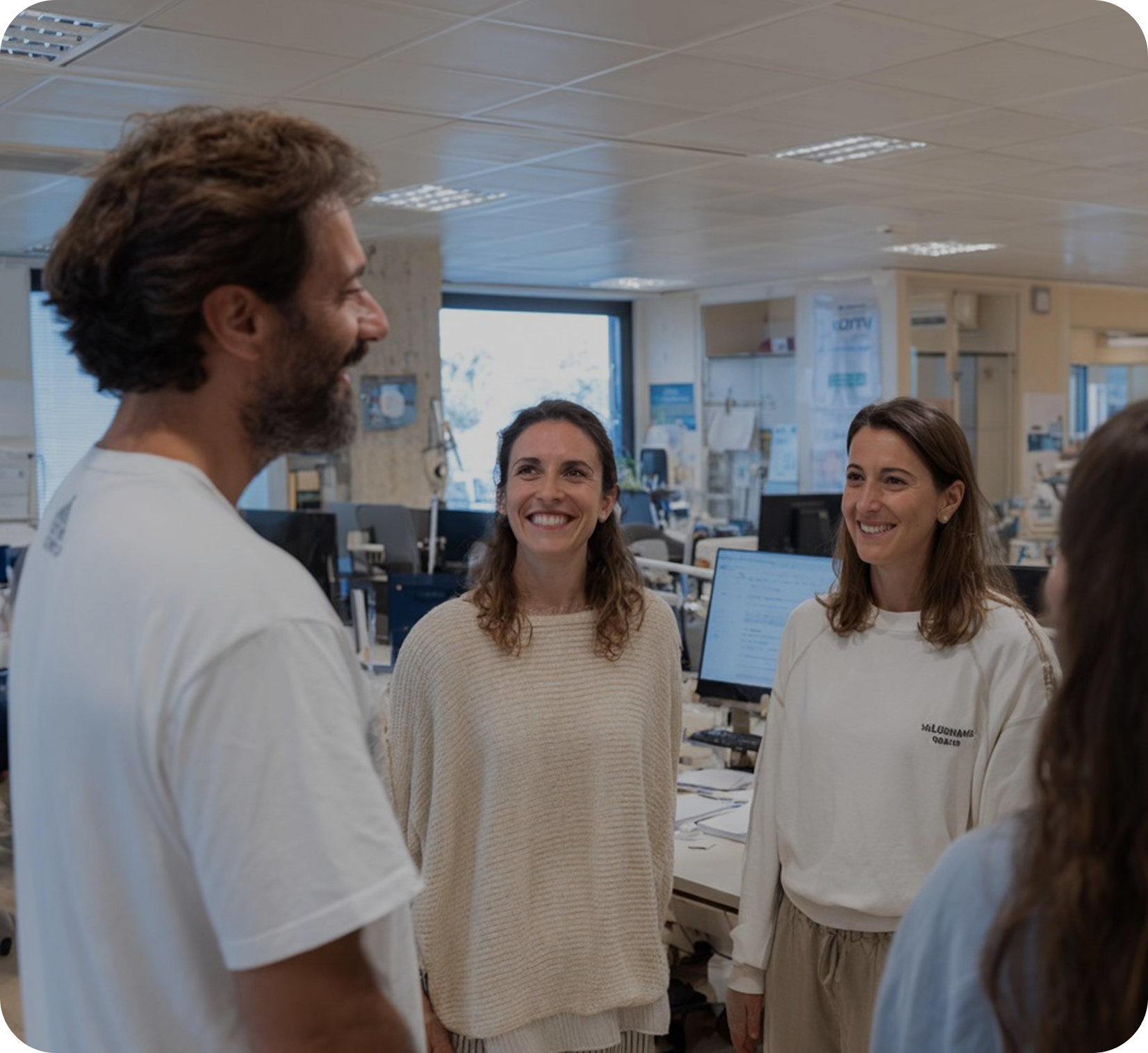 Homeos team talking inside a lab